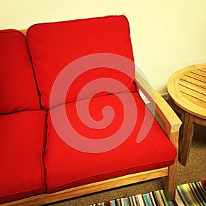Red sofa and wooden table