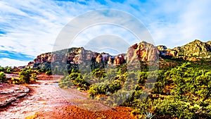 Red Soil and colorful Lee Mountain and other red rock mountains surrounding the town of Sedona in northern Arizona