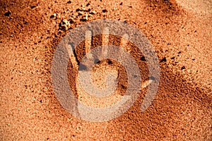 Red soil hand shape on sand like aboriginal art style