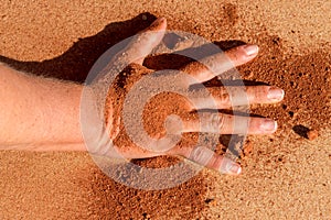 Red soil hand shape on sand like aboriginal art style