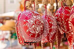 Red souvenir cow bells for sale in Salzburg, Austria