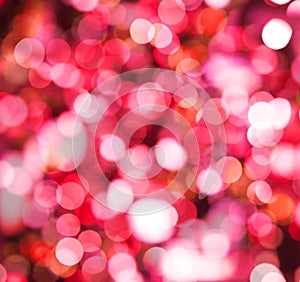 Red sparkle background with abstract bokeh glitter light