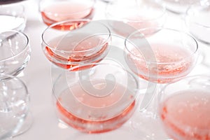 Red sparkling wine in a few glasses