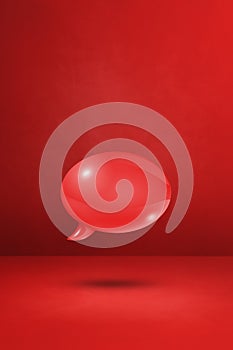 Red speech bubble on concrete wall vertical background