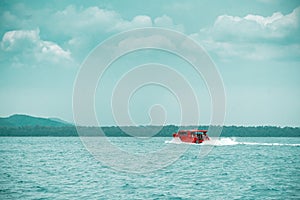 Red speed boat driving on ocean