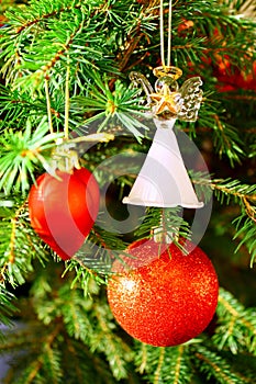 Red sphere, red heart and glass angel on Christmas tree