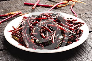 Red spinach stir fry from Asian cuisine.