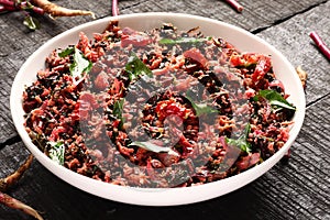 Red spinach stir fry with coconut,