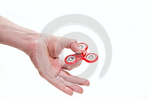 Red spinner on hand and white background