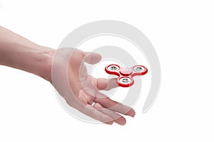 Red spinner on hand and white background