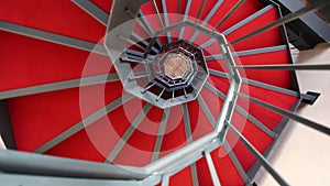 Red spiral staircase that whirls around