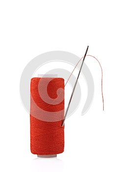 Red spool with needle
