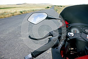 Red sport bike stands on the track