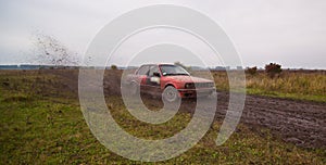 Red sport car drive on the dirt