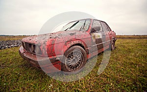 Red sport car stay on the dirt