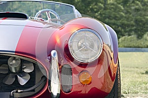 Red sports car front half ground view