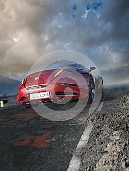 Red sports car moving on the mountain road