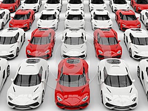 Red sports cars in formation amongst white cars