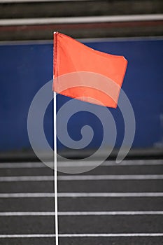 Red sports flag on track and field