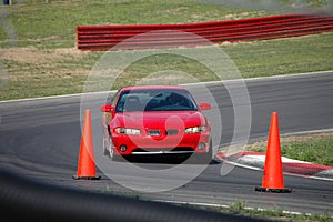 Red Sports Sedan on Race Track