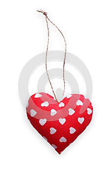 Red spotted sewed pillow heart isolated on white background, valentine