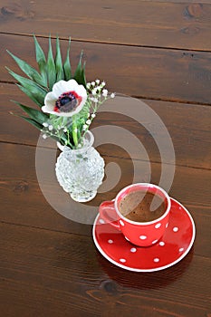 Red spotty mug and anemone