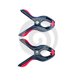 Red spring clamp on white