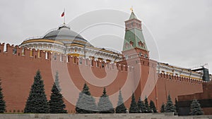 Red Square, Moscow, Russia. View of the Kremlin wall with the Senate Tower. Over the Senate Palace on the flagpole is