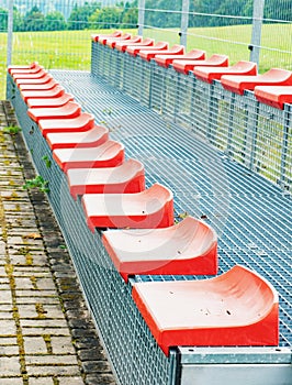 Red stadium seats, side view