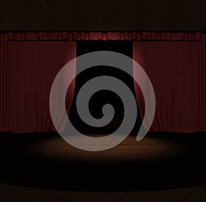 Red stage curtain with spotlight on stage