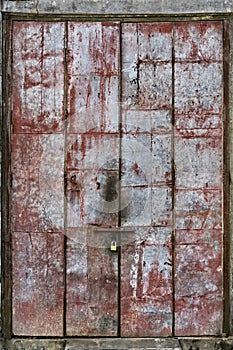 Red-stained Metal Door