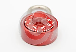 Red stainless steel lock on a white background