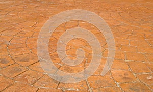 Red Stamped Concrete Patio in Backyard