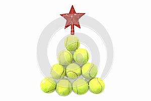 Red star on tennis ball on white snow background. Merry Christmas and New year concept with tennis balls.