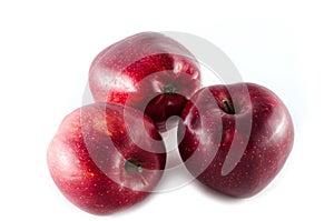 Red stark apples isolated on white background photo