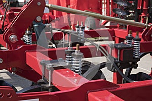 Red steam valves and other pressure equipment in industrial facility