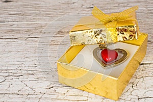 Red steel heart in gift box