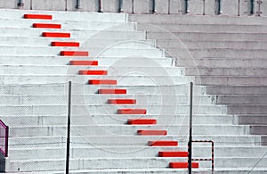 Red steps in football stadium bleachers