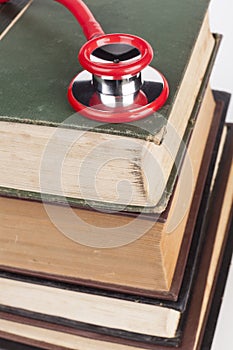 Red Stethoscope on Books