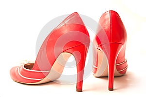 Red stilettos shoes on white background