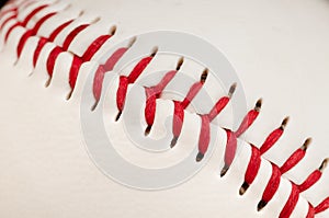 Red stitches on the seam baseball photo