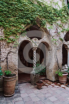 Red stone column in countryard of Villa Cimbrone garden , in Ravello, Amalfi Coast, Italy photo