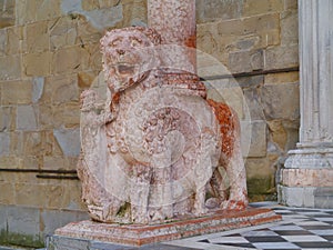 Red stone lion as a waiter in the Italian city Bergamo