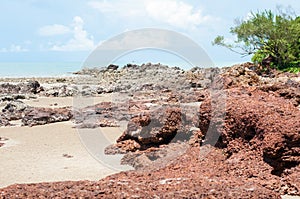 the red stone and rock on the sand beach in clear blue sky and n