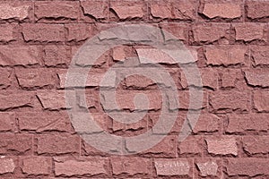 Red stone wall background. Decorative stone texture
