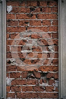 Red Stone Wall Texture with old Bricks and mortar on a damaged Cemetery Ruin in Berlin. Can be used as a texture or