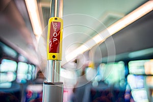 red STOP button on the passenger bus bar.