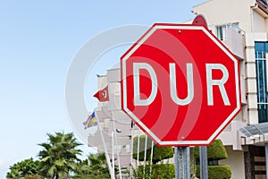 Red stop or DUR sign in Turkish photo