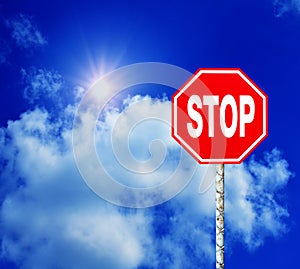 Red Stop Sign with Blue Sky