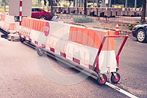 Red stop sign in the middle of a block road movable board